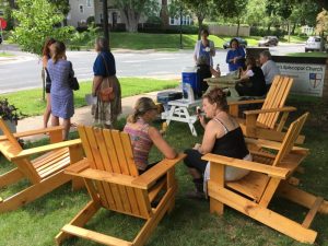 people gather to chat outside